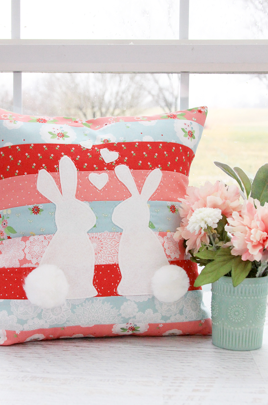 "Spring Bunnies in Love” is a Free Easter Quilted Pillow Pattern designed by Bev from Flamingo Toes!