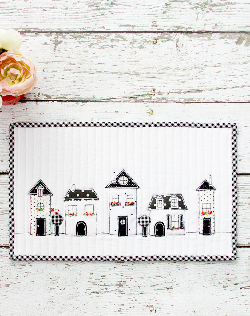2019 Top Ten Quilting and Sewing Projects! by popular Tennessee quilting blog, Flamingo Toes: image of a black and white neighborhood mini quilt. 