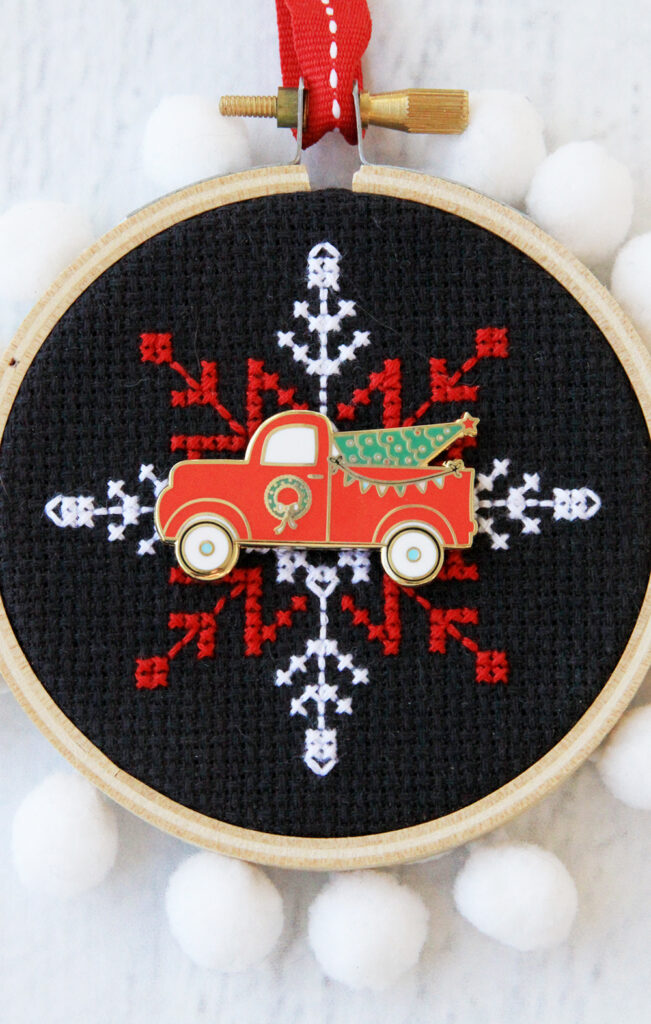 Happy Little Things Quilt Block 4 by popular quilting blog, Flamingo Toes: image of a Christmas Needle Minder enamel vintage truck Christmas pin.